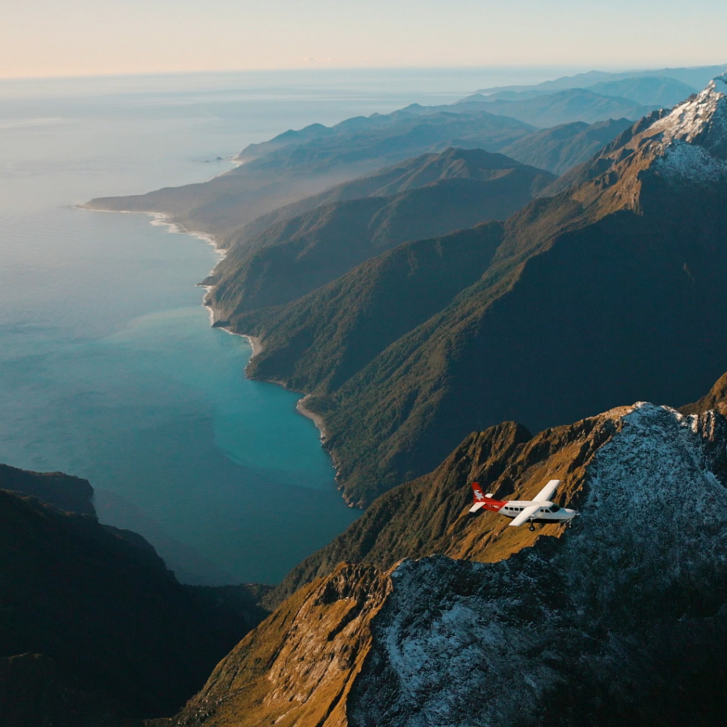 Milford Sound Fly Cruise Fly scenic flight over snow-covered mountains