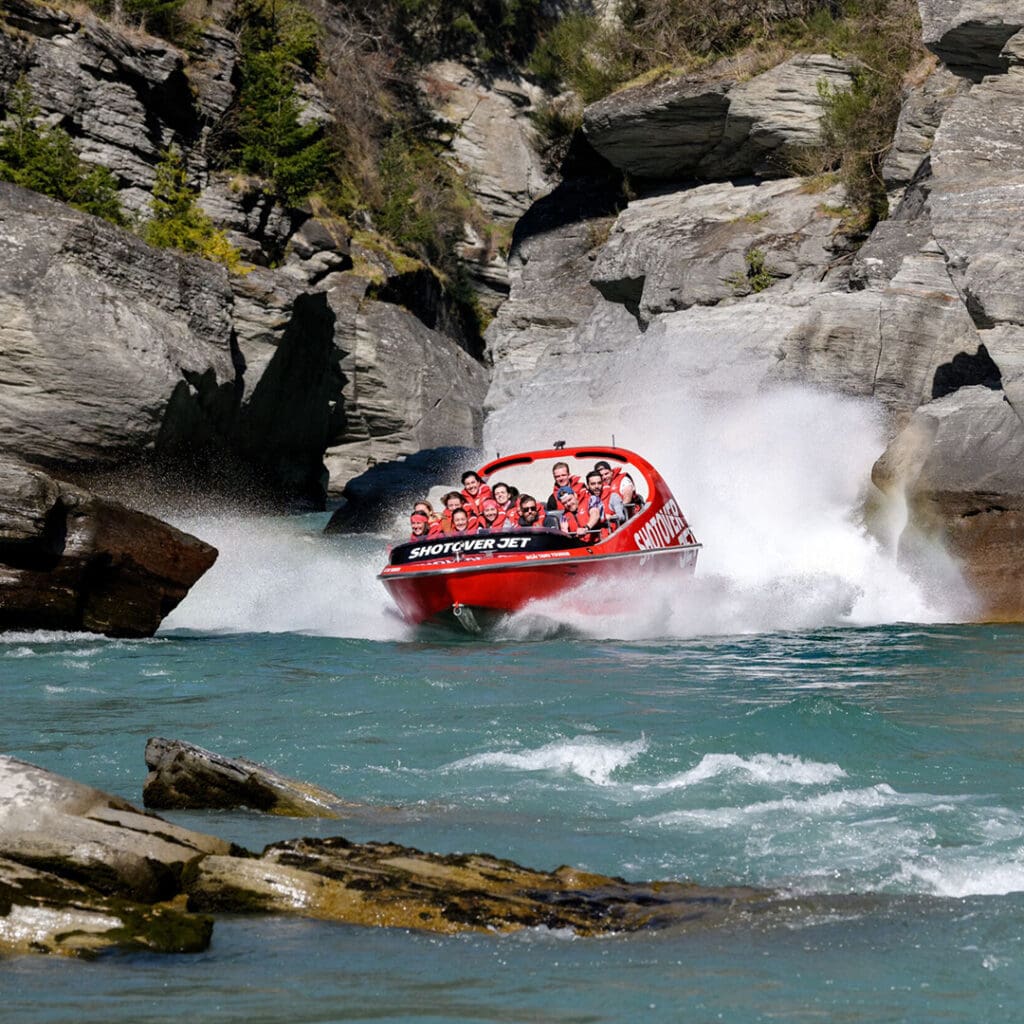 Shotover Jet Boat racing through narrow Queenstown canyon